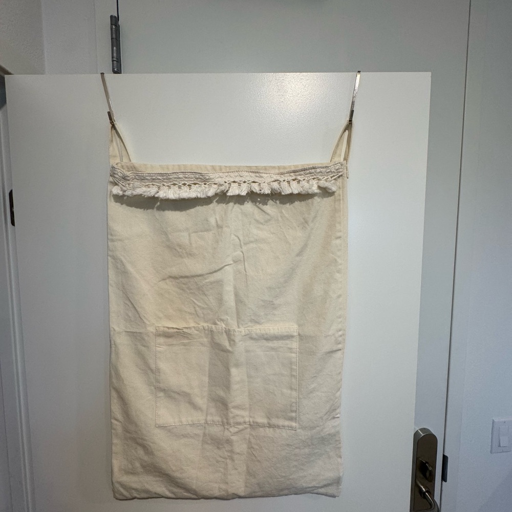 Cream over the door laundry bag